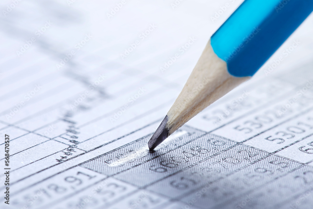 Checking the value of securities. Pencil, share listing and checking financial chart. Concept of banking, financial report and financial audit. Checking the value of securities. Pencil, share listing and checking financial chart. Concept of banking, financial report and financial audit.