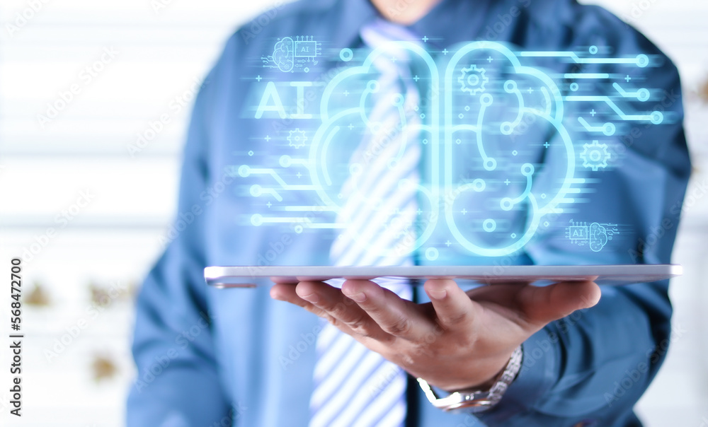 Businessman touching the brain working of Artificial Intelligence (AI) in the futuristic business and coding software development on interface and synchronize network connection, IoT, innovative. Businessman touching the brain working of Artificial Intelligence (AI) in the futuristic business and coding software development on interface and synchronize network connection, IoT, innovative.