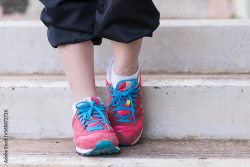 beautifull sport girl exercise at the track court and wearing blue sport bra