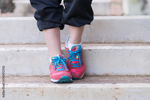 beautifull sport girl exercise at the track court and wearing blue sport bra