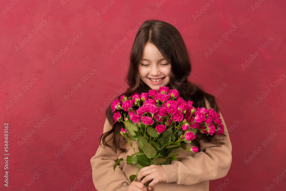 Embarrassed girl with a bouquet of pink roses Embarrassed girl with a bouquet of pink roses