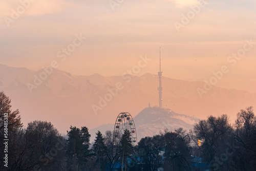 winter sunset view from city park to Koktobe mountain with TV tower in Almaty, Kazakhstan photo