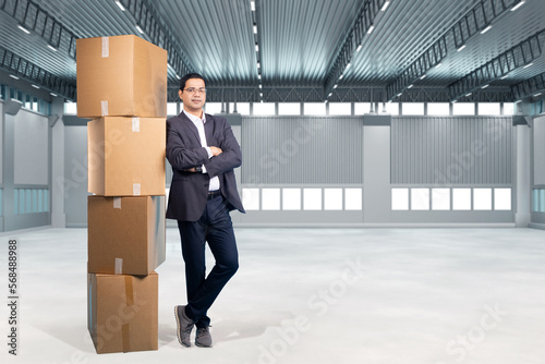 Business man in empty wareh...