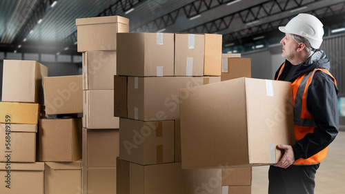 Man warehouse loader. Guy w...