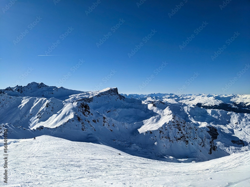 Ski tour on the Rotspitz mountain above Partnun St. Antönien and Gargellen. Ski mountaineering in the Swiss Alps. Snow covered mountains. High quality photo.