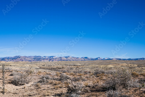 Distant mountains with high desert in the foreground, western Colorado