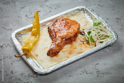 Grilled pork loin on the bone