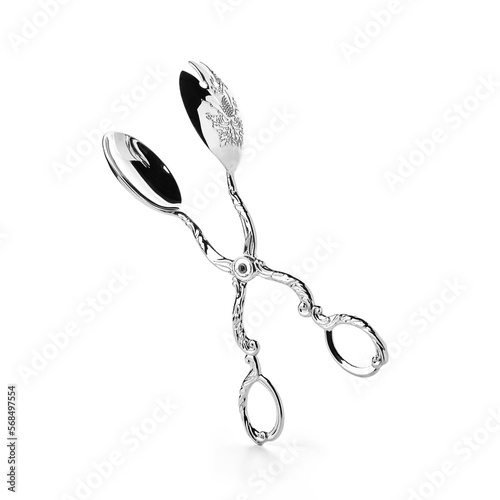 Spoon scissors on white background