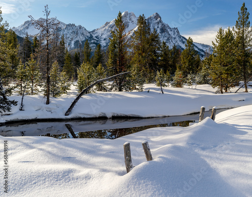 Idaho winter landscape with snow fence and mountain photo