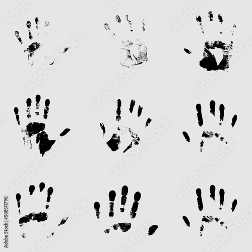 Set of black human palm prints on a white background.