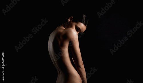 Nude Woman silhouette. Back of Beautiful Naked Body Girl