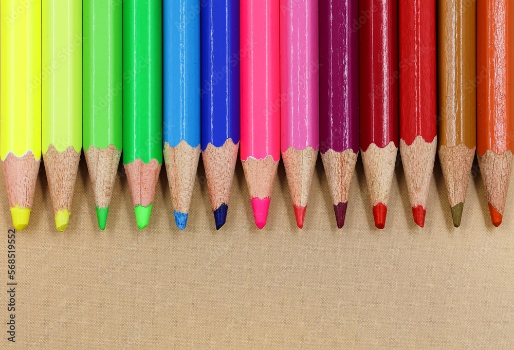 Colored pencils in a row. Top view. Back to school concept. Colored pencils in a row. Top view. Back to school concept.