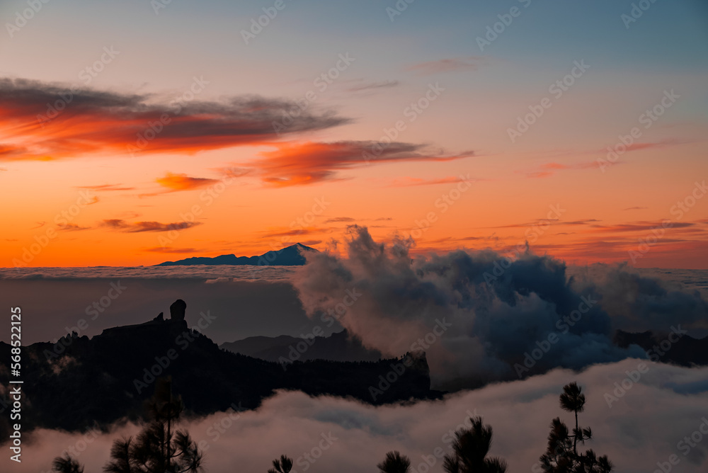 Spectacular sunset above the clouds of the Teide volcano national park on Tenerife. Sunset from the top of Gran Canaria Island. Pico de las Nieves.
