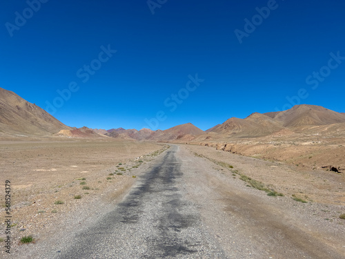 A shabby road through the mountains.