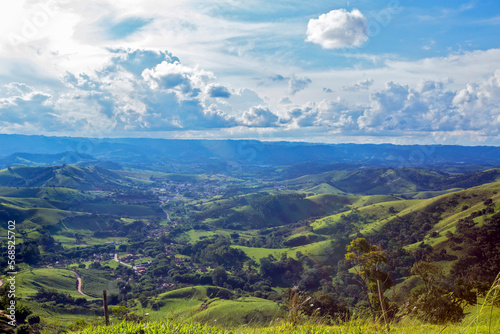 Small town nestled among the green hills of Serra da Mantiqueira in the state of Minas Gerais, Brazil © Casa.da.Photo