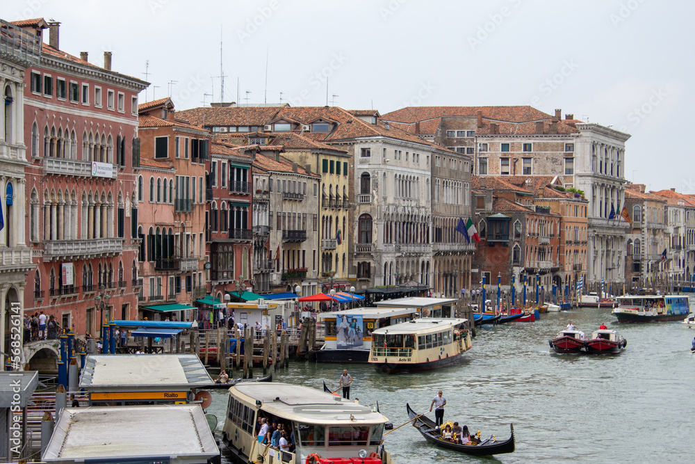 Venetian canals with countless boats and gondolas. 