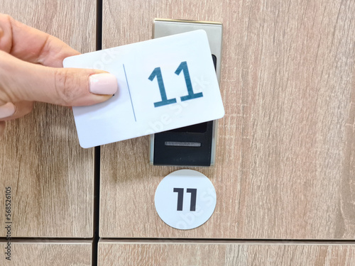 Closeup on manual locker opening in dressing room with electronic card-shaped transponder