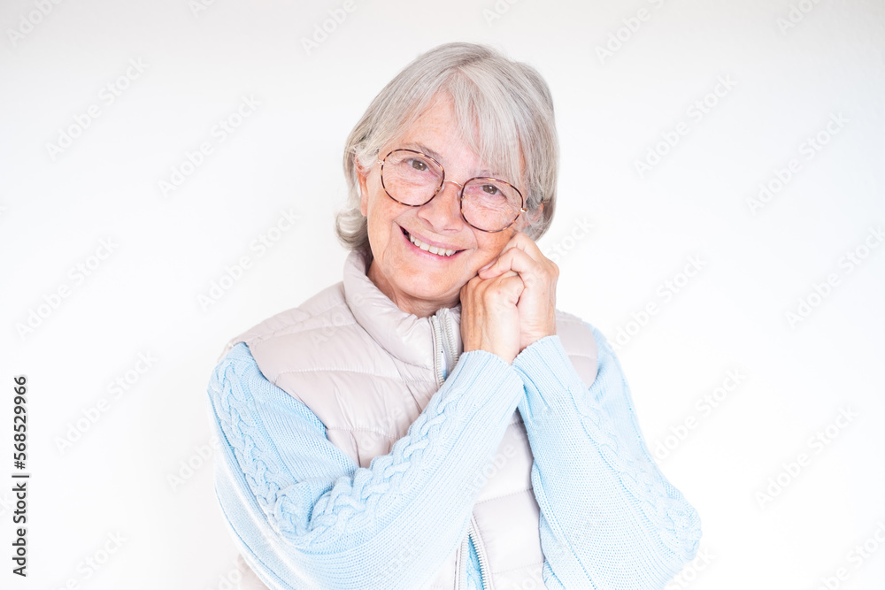 Close-up portrait of smiling white-haired senior woman touching her face with hands. Attractive mature lady in good mood isolated on white background Close-up portrait of smiling white-haired senior woman touching her face with hands. Attractive mature lady in good mood isolated on white background