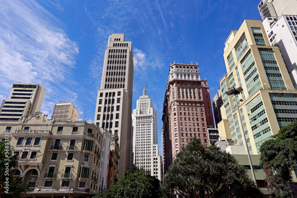 View of the buildings in Anhangabaú Valley with a blue sky in the background. Downtown of São Paulo city, Brazil View of the buildings in Anhangabaú Valley with a blue sky in the background. Downtown of São Paulo city, Brazil
