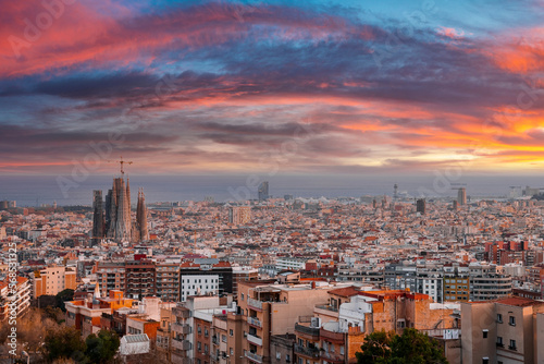 Photography Beautiful aerial view of the Barcelona city with a Sagrada Familia cathedral standing in the city center