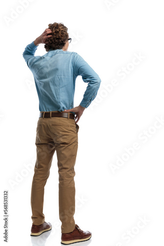 casual man scratching his head and feeling confused