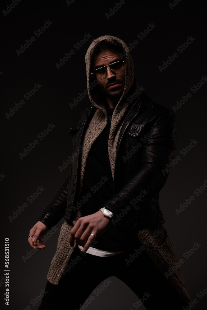 Fototapeta premium cool young man with glasses posing in a confident manner