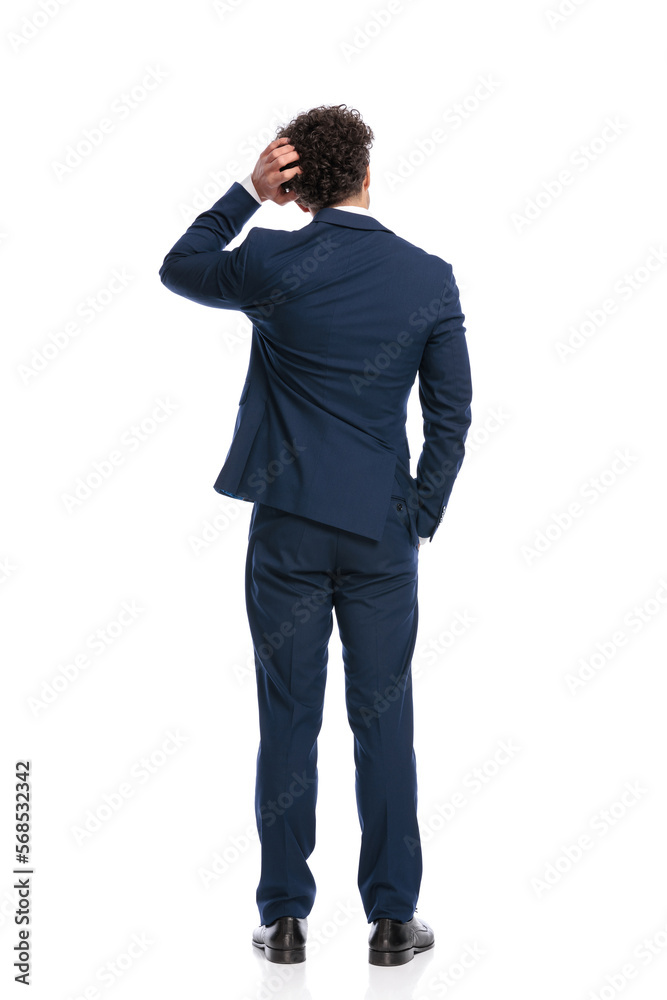 confused young businessman scratching head and thinking confused young businessman scratching head and thinking