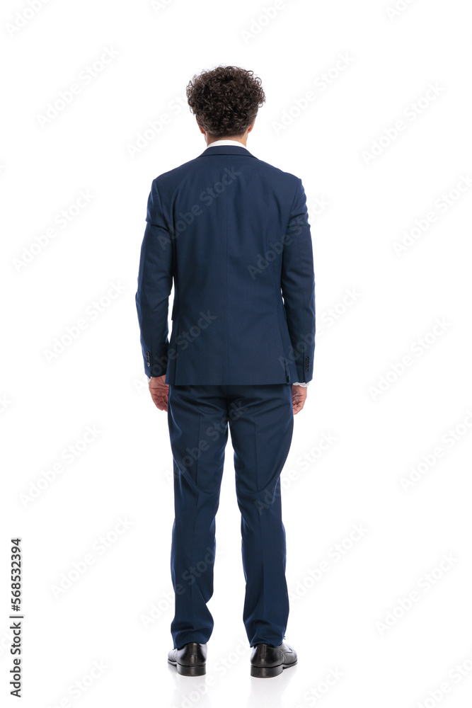 elegant man in suit standing in front of white background elegant man in suit standing in front of white background