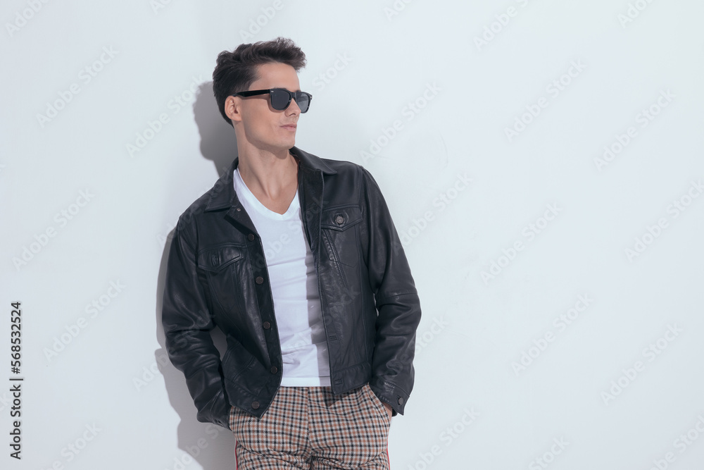 Fototapeta premium casual man looking away with hands in pockets