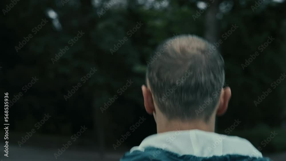 Close-up of man jogging in the park. Close-up of man jogging in the park.
