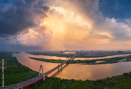 Panorama sunset in Nhat Tan bride over the Red river Hanoi Vietnam