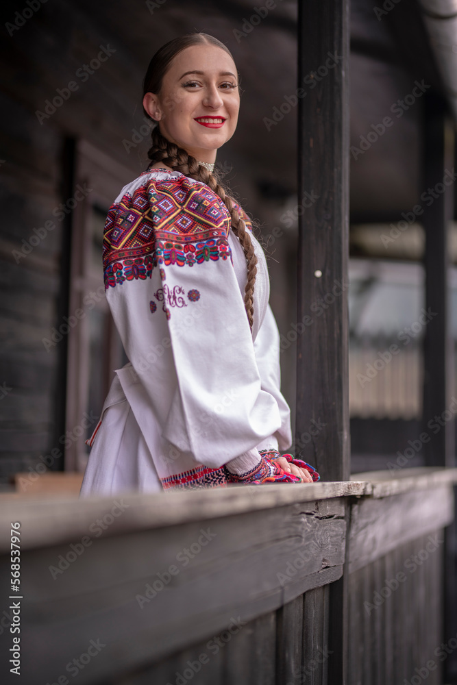 Young beautiful slovak woman in traditional costume. Slovak folklore