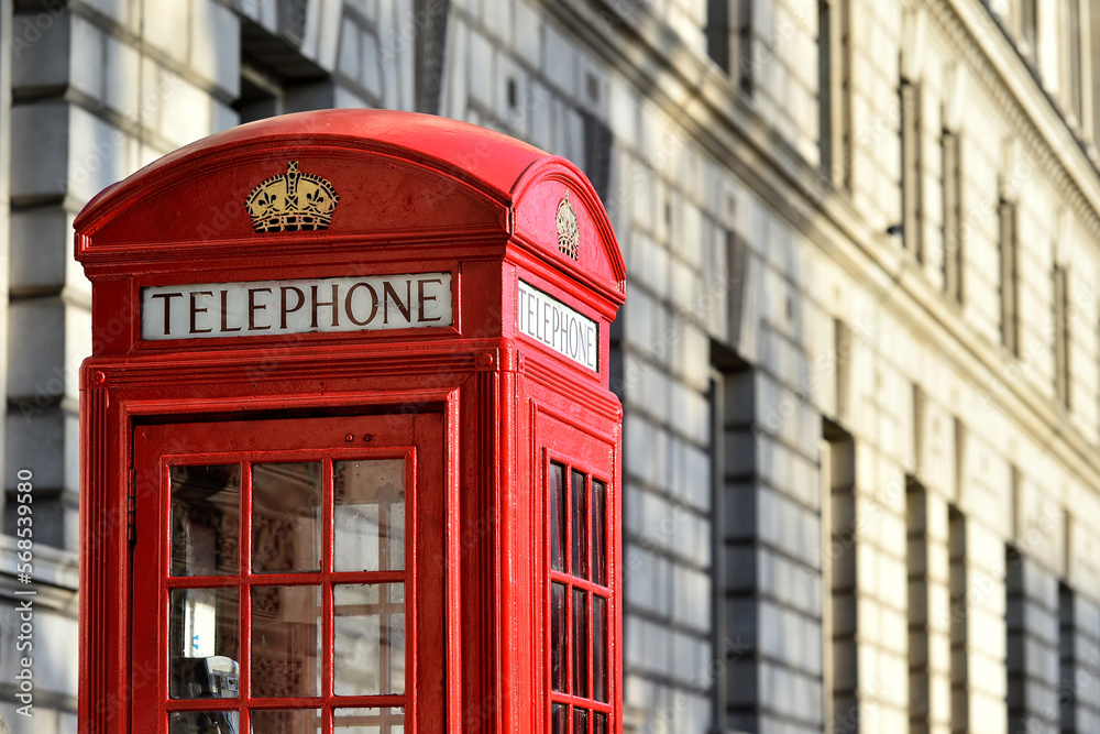 Main London symbols: red public telephone cabin nearby of Westminster Palace in Great Britain. Main London symbols: red public telephone cabin nearby of Westminster Palace in Great Britain.