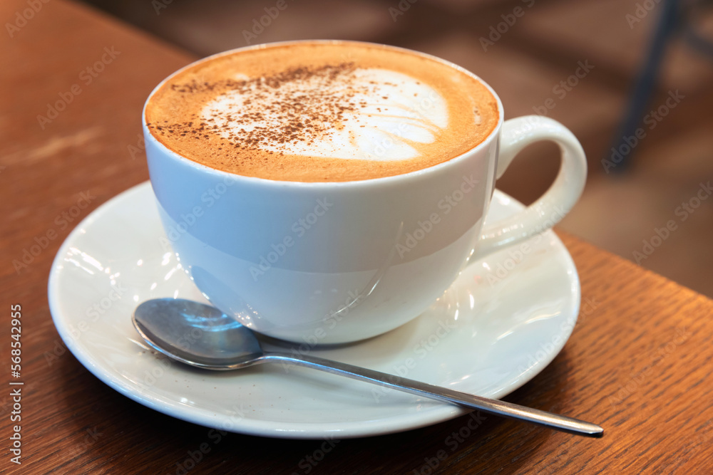 Cup of Cappuccino. Coffee with milk foam and cinnamon powder Cup of Cappuccino. Coffee with milk foam and cinnamon powder