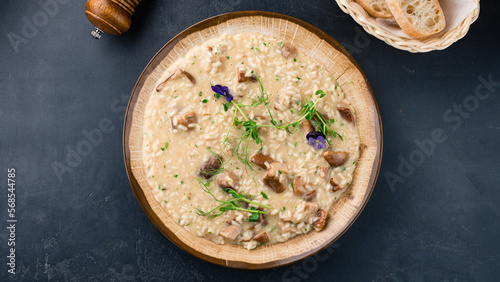 Italian lunch risotto with porcini mushrooms and herbs.
