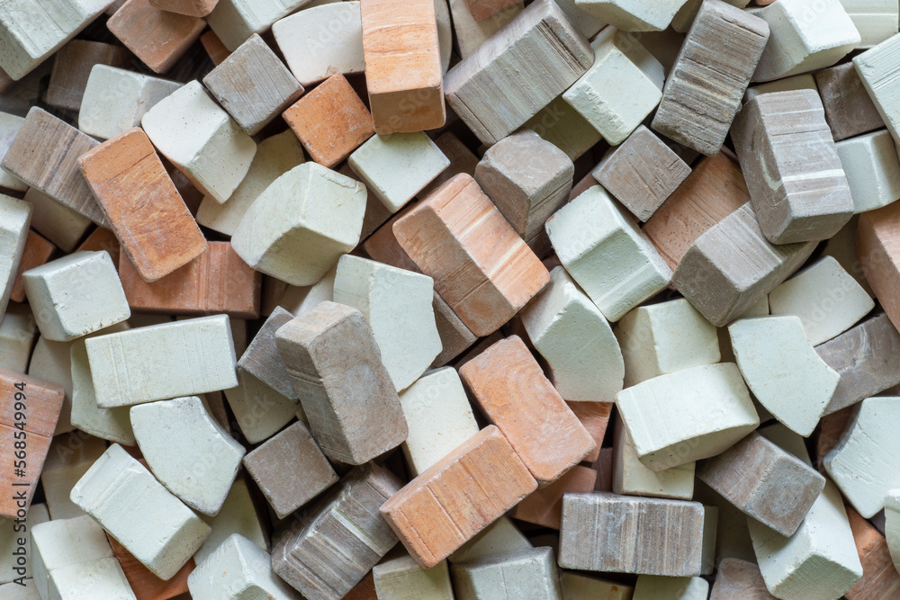 A pile of varied color miniature toy bricks as the background. Construction concept A pile of varied color miniature toy bricks as the background. Construction concept