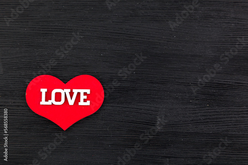 inscription I love you on a black wooden background