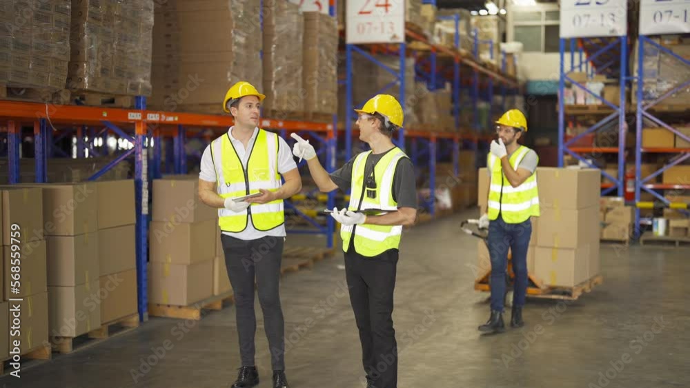Teamwork of workers working in large warehouse retail store industry.Rack of stock storage. Interior of cargo in ecommerce and logistic concept. Depot. People lifestyle. Shipment service for container Teamwork of workers working in large warehouse retail store industry.Rack of stock storage. Interior of cargo in ecommerce and logistic concept. Depot. People lifestyle. Shipment service for container