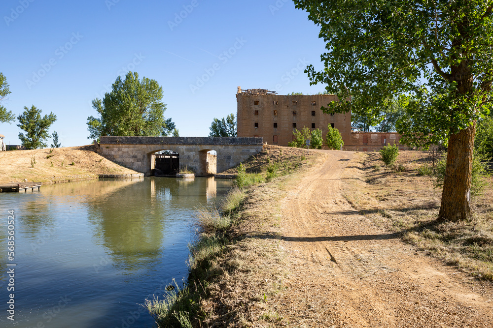 dirt road along the Canal de Castilla at lock 7 - Ramal de Campos next to Tamariz de Campos, province of Valladolid, Castile and Leon, Spain