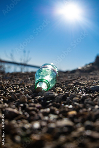 glass bottle on the lake shore