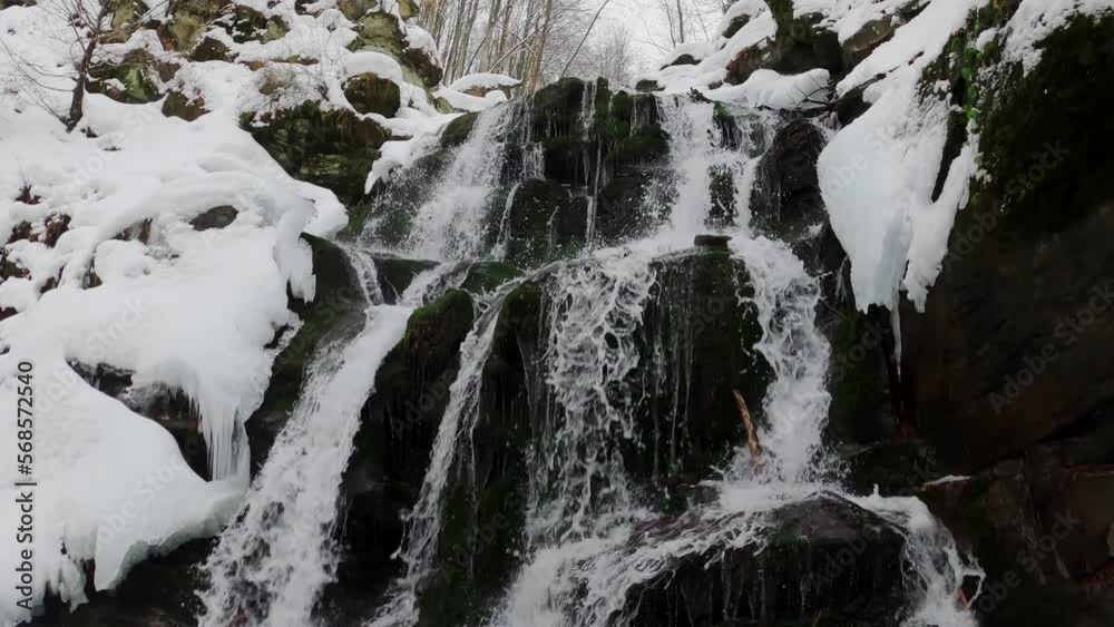 A waterfall on the northern slopes of the Polonyna Borzhava mountain massif at the foot of Mount Gemba in the Ukrainian Carpathians. Shypit waterfall. Winter in the mountains of Ukraine A waterfall on the northern slopes of the Polonyna Borzhava mountain massif at the foot of Mount Gemba in the Ukrainian Carpathians. Shypit waterfall. Winter in the mountains of Ukraine