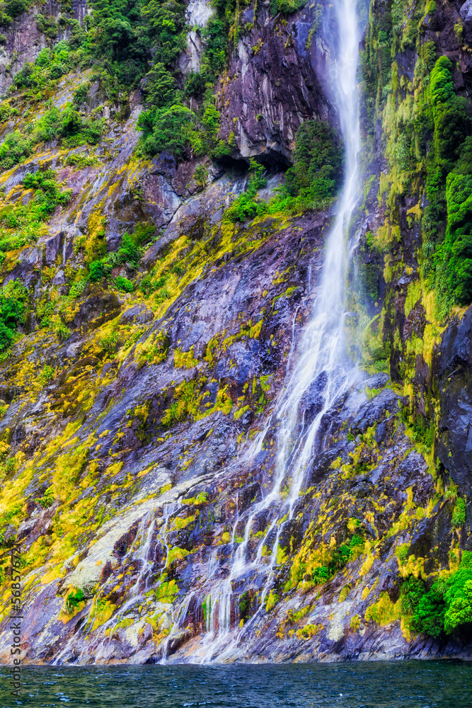 NZ Milford Sound Cliff waterfrall no sky NZ Milford Sound Cliff waterfrall no sky