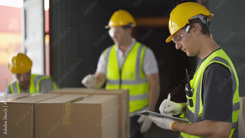 Teamwork of workers working in large warehouse retail store industry.Rack of stock storage. Interior of cargo in ecommerce and logistic concept. Depot. People lifestyle. Shipment service for container Teamwork of workers working in large warehouse retail store industry.Rack of stock storage. Interior of cargo in ecommerce and logistic concept. Depot. People lifestyle. Shipment service for container
