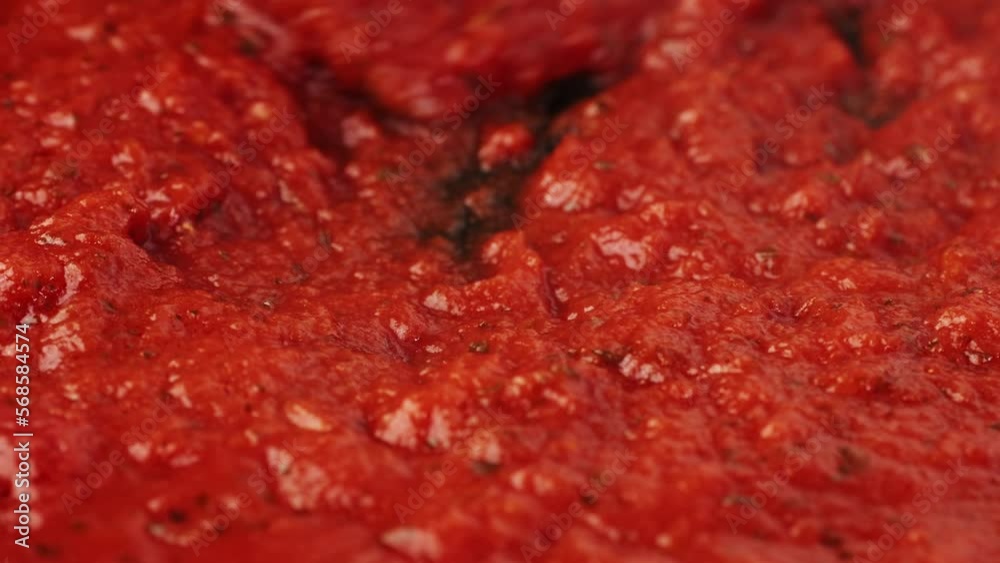 Classic homemade Italian tomato sauce with basil for pasta and pizza in the pan. Chef cooking traditional Italian food. Classic homemade Italian tomato sauce with basil for pasta and pizza in the pan. Chef cooking traditional Italian food.