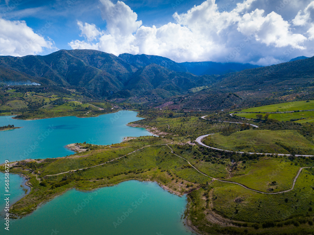Aerial view of spring landscape of Zahara-el Gastor reservoir, artificial lake surrounded by mountains and hills, Spain