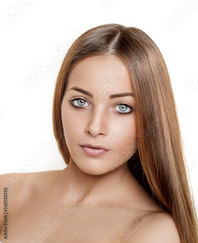 Woman with beautiful straight healthy voluminous hair. Girl with beauty hair. Model with perfect makeup and clean glowing skin