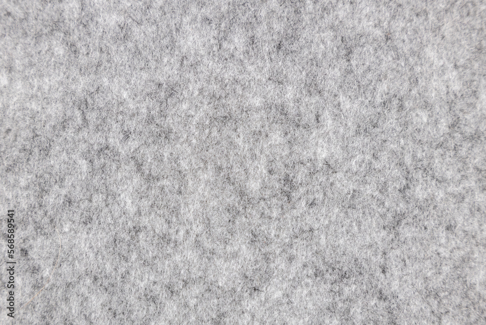 Fototapeta premium Gray felt texture. Fabric texture surface, close up.