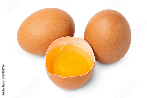 Egg. Brown eggs. Half an egg with yellow yolk. Organic raw non boiled chicken eggs. Brown eggshell. Farm bird product. Good for breakfast, cooking recipe. Food photography. isolated background.