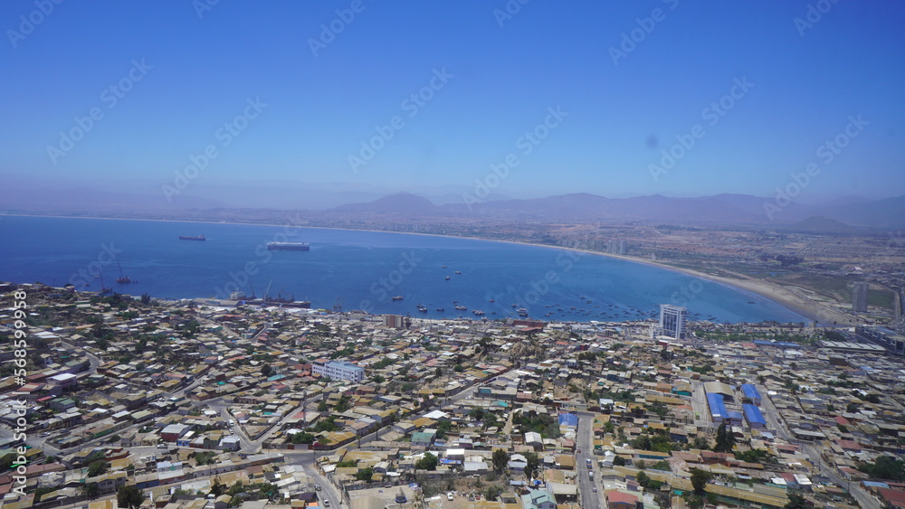 aerial view of the bay in Coquimbo, Chile. You can see the town, the sea and some large ships
