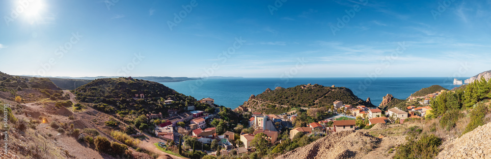 Small Touristic Town, Nebida, on the Sea Coast. Sardinia, Italy. Sunny Day. Panorama